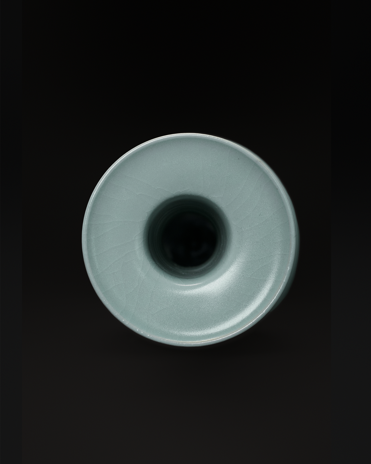 Second top-down view of the celadon vase showing the broad dish-shaped mouth and central opening.