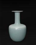 Front view of a celadon vase with a broad dish-shaped mouth, long neck and rounded rectangular body.