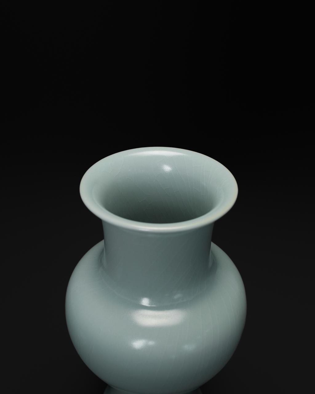 Angled top view of the Guanyin vase showing its flared rim, narrow neck and rounded shoulder.