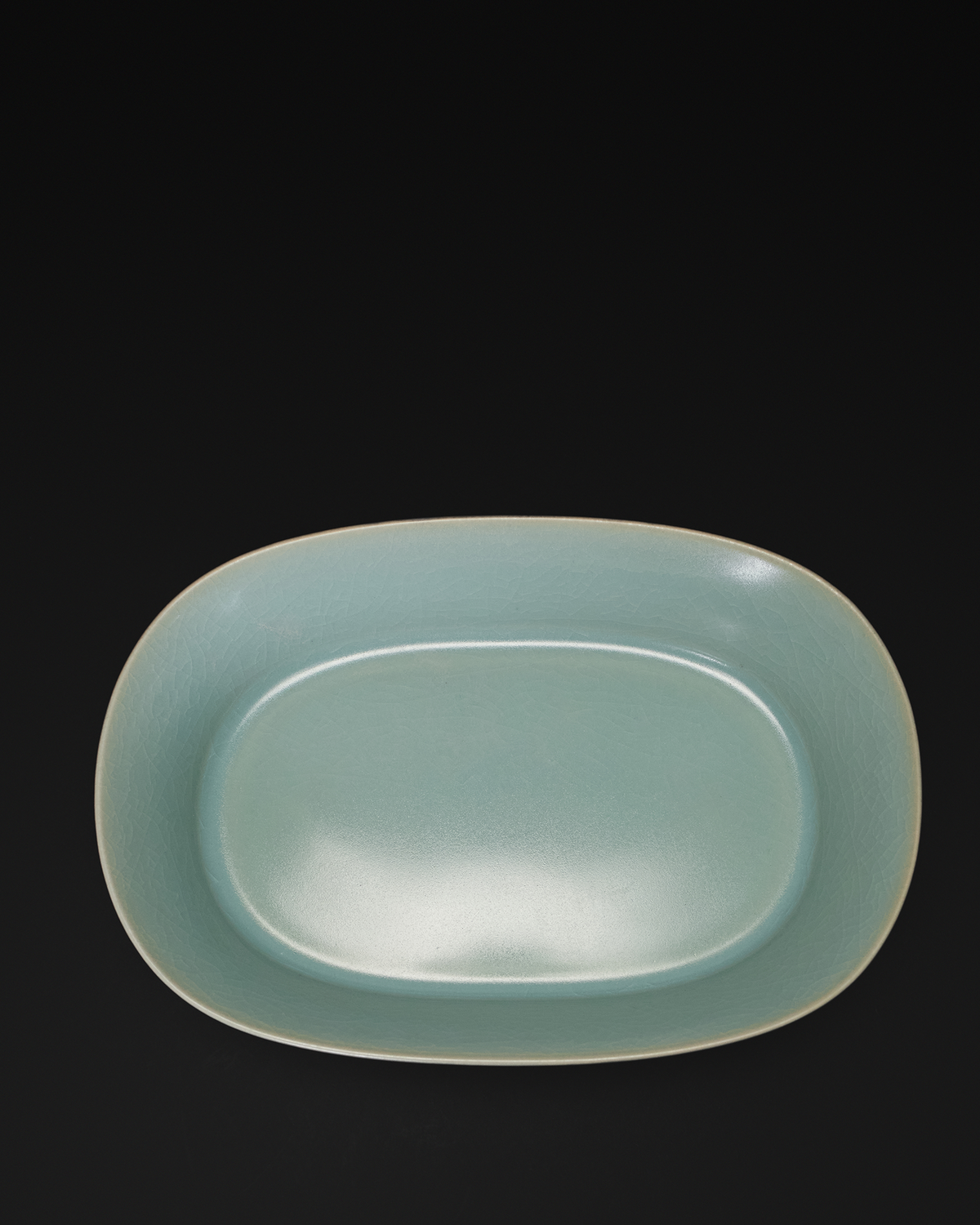 Top view of the celadon narcissus basin highlighting the oval interior and gently rounded rim.