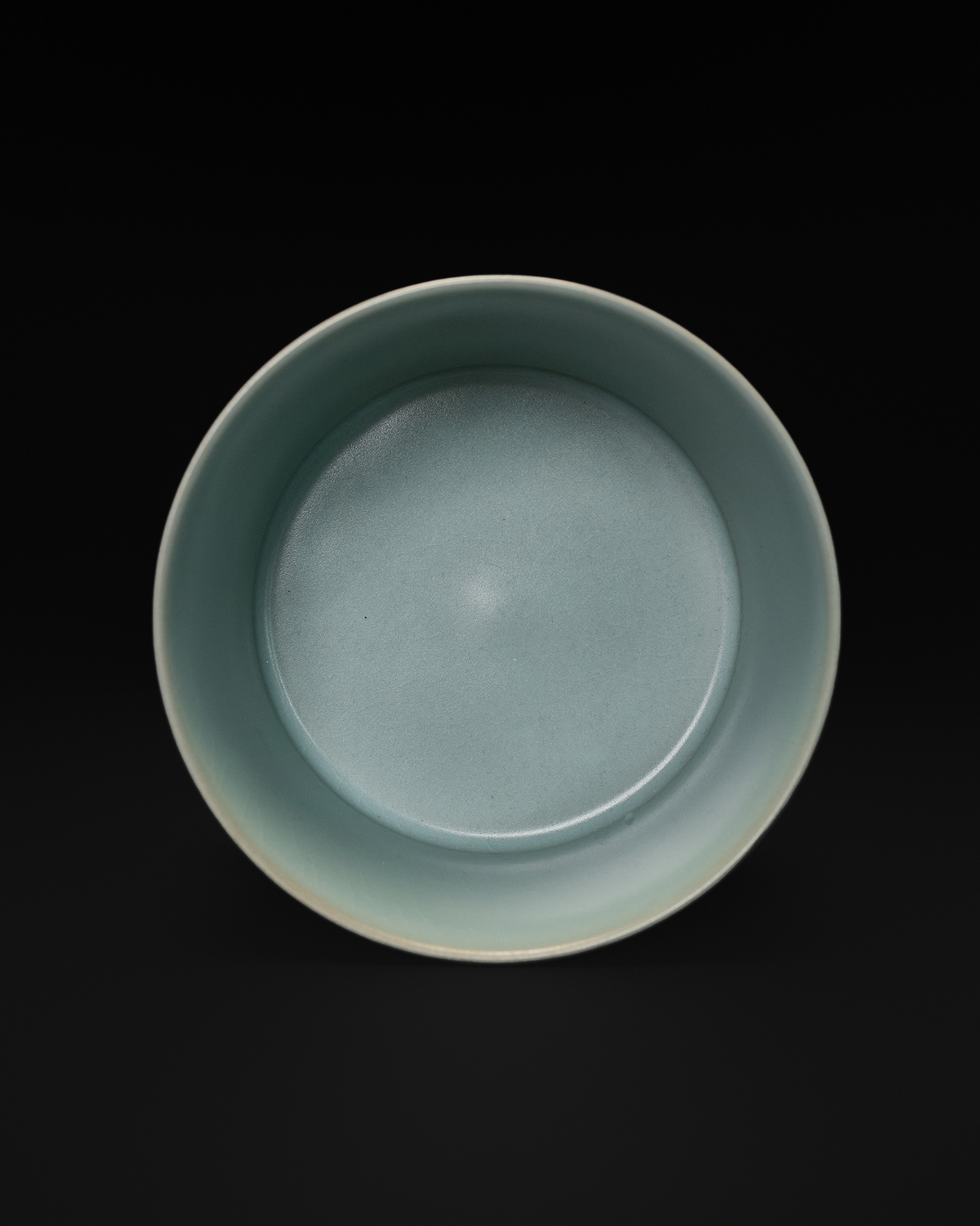 Top view of the ribbed ceramic vase highlighting its round opening and softly glazed interior.
